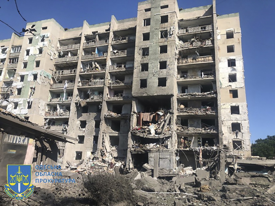 In this photo provided by the Odesa Regional Prosecutor's Office, a damaged residential building is seen in Odesa, Ukraine, early Friday, July 1, 2022, following Russian missile attacks. Ukrainian authorities said Russian missile attacks on residential buildings in the port city of Odesa have killed more than a dozen people.