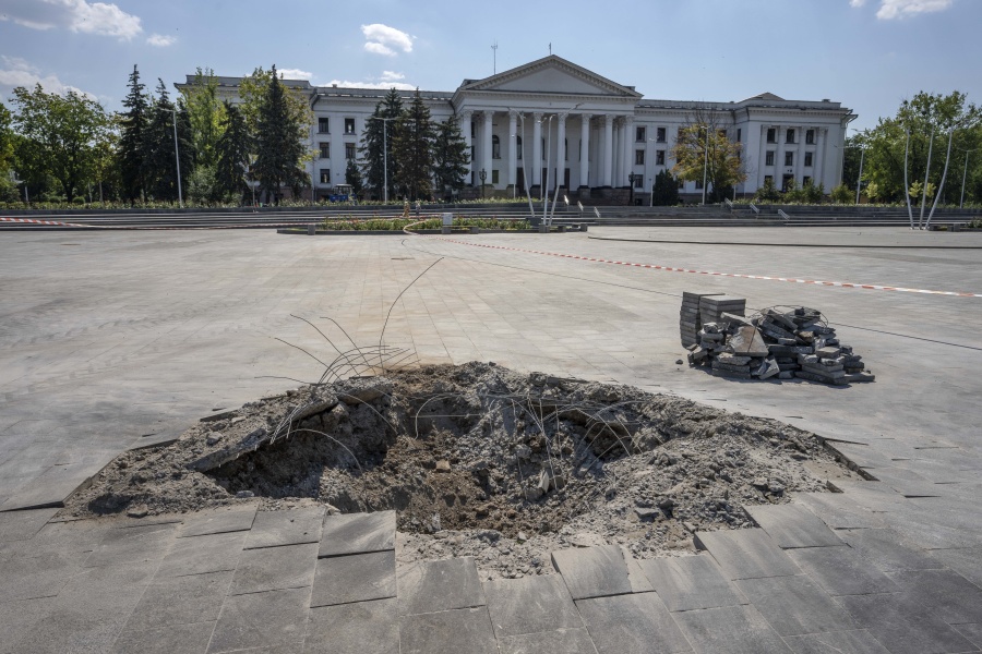 A crater in the aftermath of a Russian missile strike, in front of the city council hall building, in Kramatorsk city hall, eastern Ukraine, Saturday, July 16, 2022. Ukrainians living in the path of Russia's invasion in the besieged eastern Donetsk region are bracing themselves for the possibility that they will have to evacuate.
