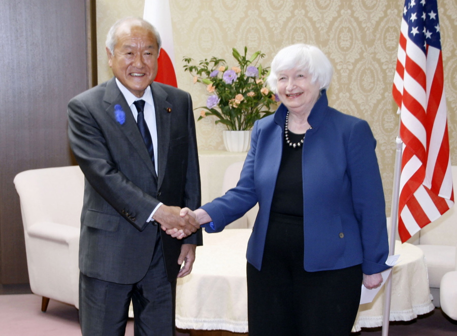 U.S. Treasury Secretary Janet Yellen, right, and Japan's Finance Minister Shunichi Suzuki shake hands during their meeting at the finance ministry in Tokyo, Tuesday, July 12, 2022. With thousands of sanctions already imposed on Russia to flatten its economy, the U.S. and its allies are working on new measures to starve the Russian war machine while also stopping the price of oil and gasoline from soaring to levels that could crush the global economy.