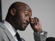 Seattle Seahawks linebacker K.J. Wright wears his Super Bowl ring as he wipes away tears while speaking at a news conference where he announced his retirement from NFL football, Thursday, July 28, 2022, in Renton, Wash. (AP Photo/Ted S.