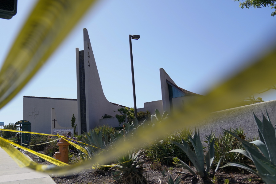 FILE - Crime scene tape surrounds Geneva Presbyterian Church on Tuesday, May 17, 2022, in Laguna Woods, Calif. A gunman opened fire on May 15 during a luncheon at the church, killing one and injuring five other members of a Taiwanese congregation that met there.