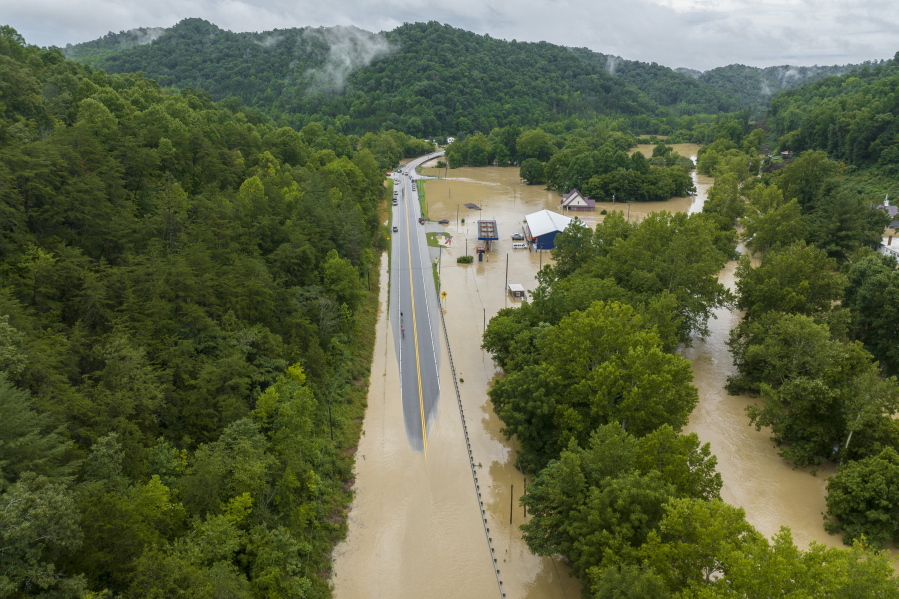 Buildings and roads are flooded near Lost Creek, Ky., Thursday, July 28, 2022. Heavy rains have caused flash flooding and mudslides as storms pound parts of central Appalachia. Kentucky Gov. Andy Beshear says it's some of the worst flooding in state history. (Ryan C.