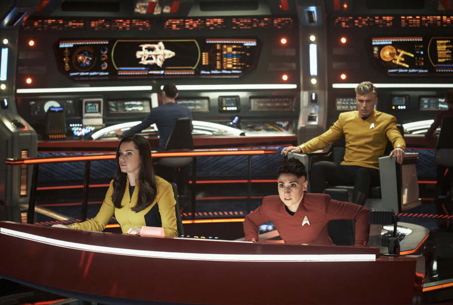 This image released by Paramount+ shows, from left, Rebecca Romijn as Una, Ethan Peck as Spock, background, Melissa Navia as Ortegas and Anson Mount as Pike in a scene from the series "Star Trek: Strange New Worlds." (Marni Grossman/Paramount+ via AP) (Marni Grossman/Paramount+)