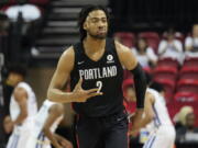 Portland Trail Blazers' Trendon Watford celebrates after making a 3-point shot against the New York Knicks during the first half an NBA summer league championship basketball game Sunday, July 17, 2022, in Las Vegas.