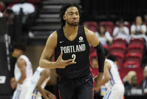 Portland Trail Blazers' Trendon Watford celebrates after making a 3-point shot against the New York Knicks during the first half an NBA summer league championship basketball game Sunday, July 17, 2022, in Las Vegas. (AP Photo/John Locher)