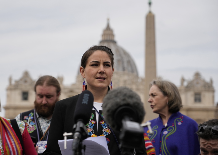 FILE - President of the Metis community, Cassidy Caron, speaks to the media in St. Peter's Square after their meeting with Pope Francis at The Vatican, Monday, March 28, 2022. The restitution of Indigenous and colonial-era artifacts, a pressing debate for museums and national collections across Europe, is one of the many agenda items awaiting Francis on his trip to Canada, which begins Sunday.