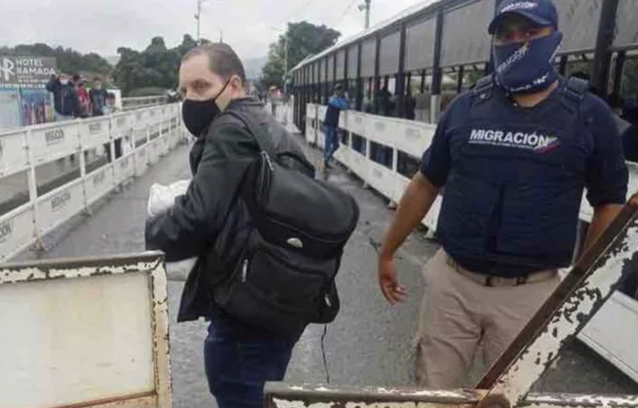 In this photo provided by the Kenemore family, Jerrel Kenemore stands at a Colombian checkpoint in the middle of the Simon Bolivar international bridge connecting San Antonio del Tachira, Venezuela with Villa del Rosario, Colombia, the second week of March 2022. Kenemore, from the Dallas area, is one of at least three American citizens who were quietly arrested in 2022 allegedly trying to enter Venezuela illegally and are being held at a maximum security prison facing long sentences, The Associated Press has learned.
