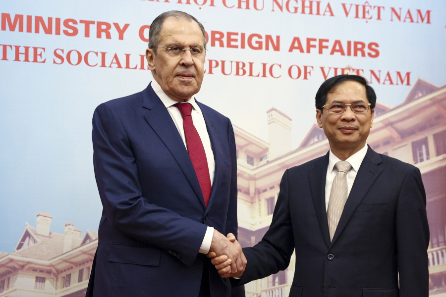 In this photo released by Russian Foreign Ministry Press Service, Russian Foreign Minister Sergey Lavrov, left, and Vietnamese Foreign Minister Bui Thanh Son shake hands during their meeting in Hanoi, Vietnam on Wednesday, July 6, 2022. Lavrov is on a trip to Asia to seek support amid his country's diplomatic isolation by the West and punishing sanctions leveled over its invasion of Ukraine.