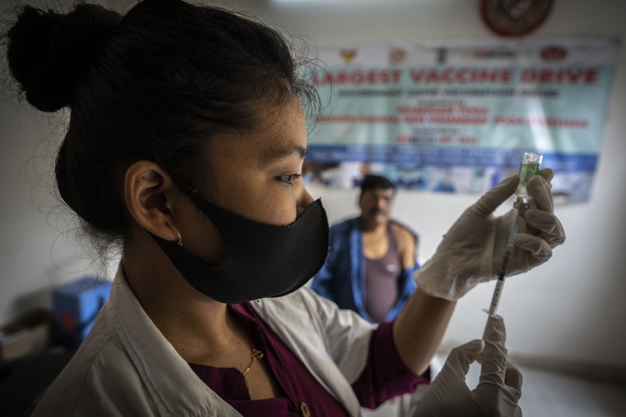 FILE- A nurse prepares to administer vaccine for COVID-19 at a private vaccination center in Gauhati, India, April 10, 2022. The quickly changing coronavirus has spawned yet another super contagious omicron mutant that's worrying scientists as it gains ground in India and pops up in numerous other countries, including the United States. Scientists say the variant, which is called BA.2.75, may be able to spread rapidly and get around immunity from vaccines and previous infection.