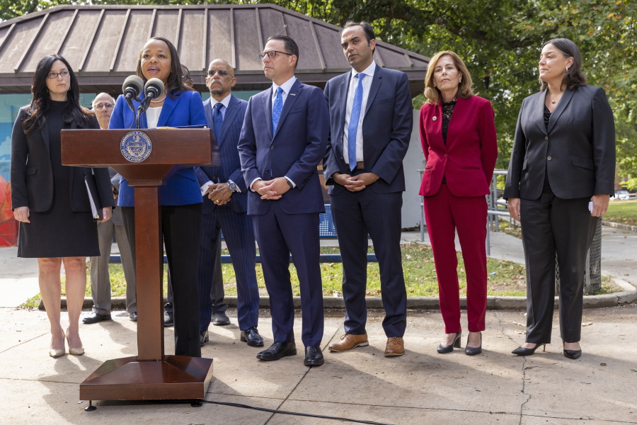 Kristen Clarke, at podium, Assistant Attorney General for the Justice Department's Civil Rights Division, is joined with, from left, New Jersey First Assistant Attorney General Lyndsay Ruotolo, Pennsylvania state Sen. Vincent Hughes, Pennsylvania Attorney General Josh Shapiro, Rohit Chopra, CFPB Director, Delaware Attorney General Kathy Jennings and Jacqueline C. Romero, United States Attorney for the Eastern District of Pennsylvania during a press conference at Malcolm X Park, Wednesday morning. July 27, 2022, West Philadelphia, Pa. Trident Mortgage Co., a division of Warren Buffett's Berkshire's HomeServices of America, discriminated against potential Black and Latino homebuyers in Philadelphia, New Jersey and Delaware, the Department of Justice said Wednesday, in what they are calling the second-largest redlining settlement in history. (Alejandro A.