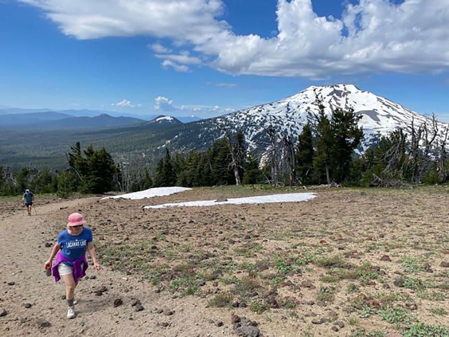 Cindy Morical, of Vancouver, Washington, hikes toward the summit of Tumalo Mountain earlier this month with Mount Bachelor in the background.