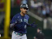 Seattle Mariners' Julio Rodriguez has missed 11 games since being hit on the wrist by a pitch July 30 in Houston.
