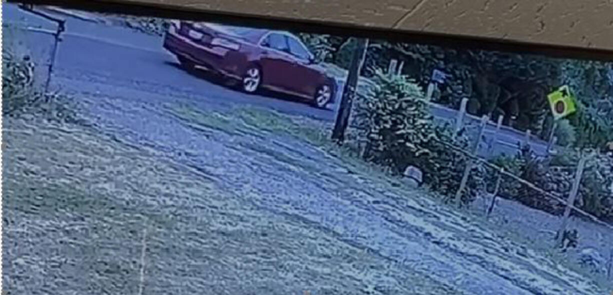 The stolen red 2010 Toyota Camry, seen on surveillance footage fleeing the area, has Washington license plate BKP4080 and should have damage to the front or front passenger's side, the sheriff's office said.