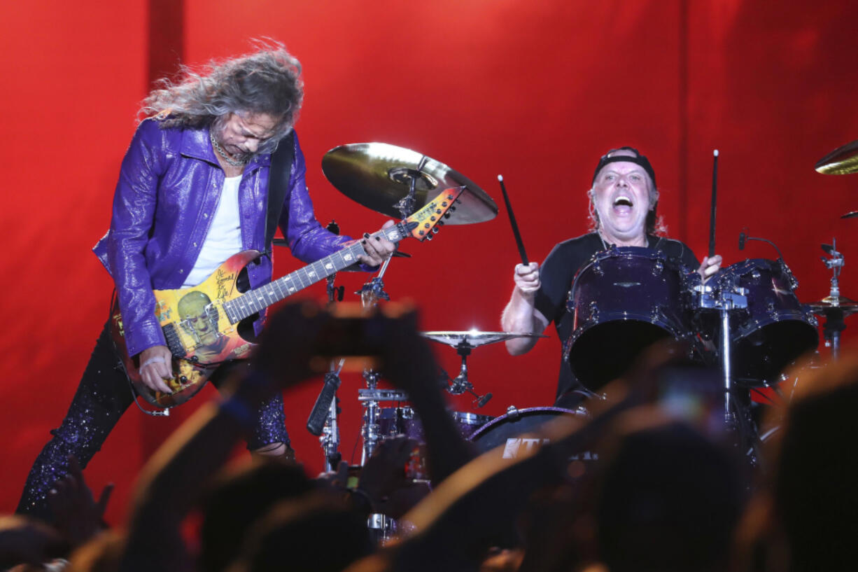 Metallica guitarist Kirk Hammett, left, and drummer Lars Ulrich perform at the Lollapalooza music festival in Grant Park in Chicago on July 28.