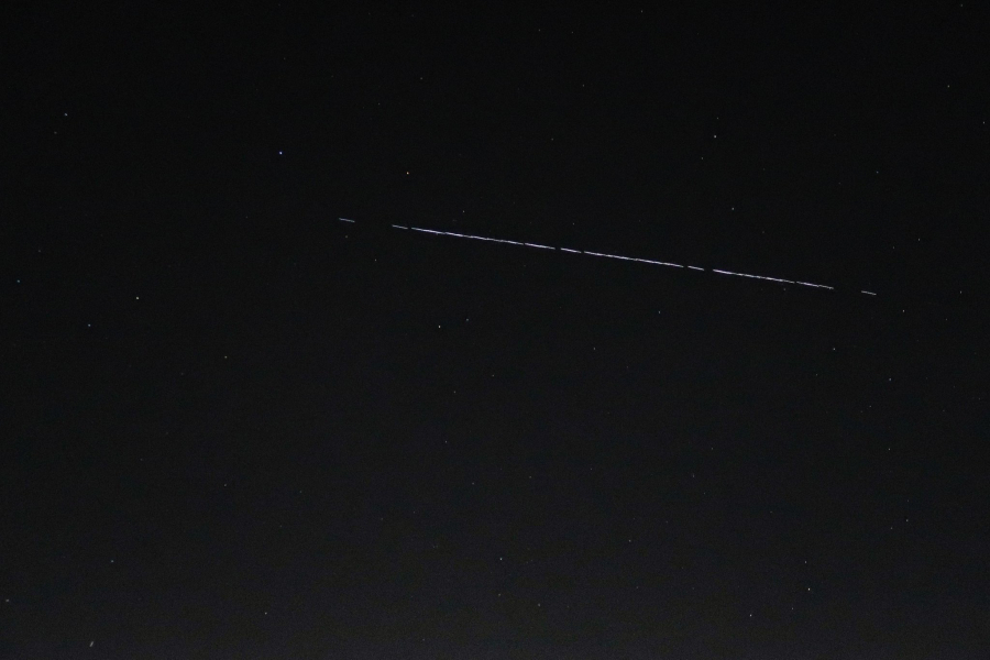 A Starlink-55 satellite train is seen Saturday night over the National Weather Service in Seattle.