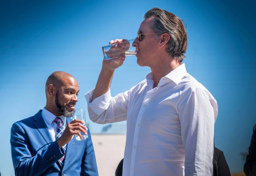 California Gov. Gavin Newsom drinks water from the Antioch Water Treatment Plant with Antioch Mayor Lamar Thorpe on Thursday, Aug. 11, 2022. The water was a sample of the future output of the Brackish Water Desalination Project, the first desalination project to be built in the Delta, currently under construction at the city's water treatment plant.