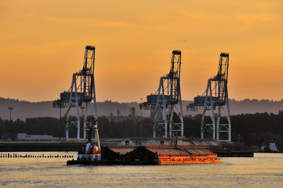 The tugboat Umatilla pushes two barges past The Port of Portland on the Columbia River near Portland. Columbia Riverkeeper received a share of federal infrastructure funding to reduce toxic pollution in the Columbia River Basin through community education and outreach.