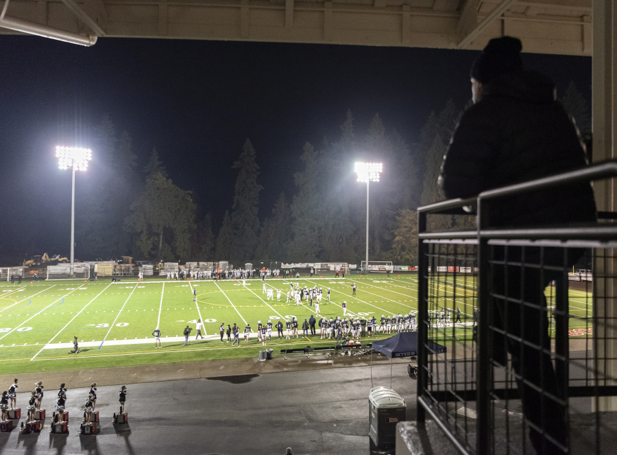 A fan watches play from the stands Thursday, Oct. 14, 2021, during the game between Union and Skyview at the Kiggins Bowl in Vancouver.