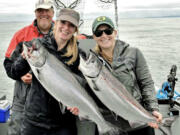 Lucienne de Boer (left) and Melissa Peterson with Buoy 10 Chinook they caught recently while fishing with guide Bob Rees. Chinook fishing was too good this year, and the states were forced to close the fishery for Chinook. Coho remains open.