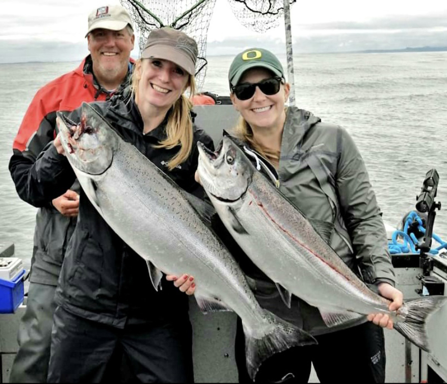 Lucienne de Boer (left) and Melissa Peterson with Buoy 10 Chinook they caught recently while fishing with guide Bob Rees. Chinook fishing was too good this year, and the states were forced to close the fishery for Chinook. Coho remains open.