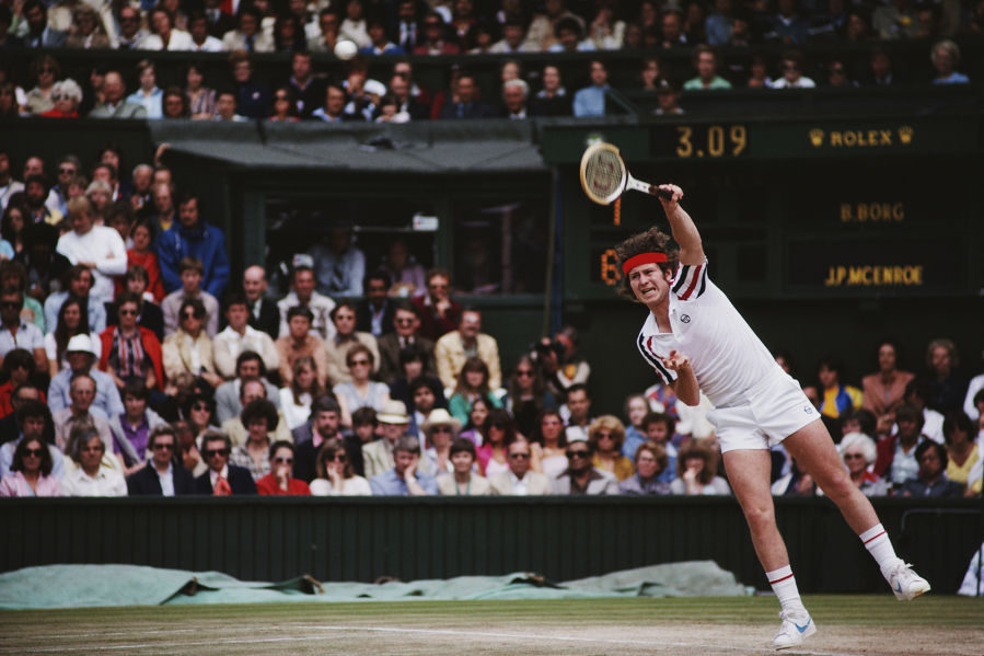 John McEnroe serves during the men's singles final match against Bjorn Borg at the Wimbledon Lawn Tennis Championship on July 5, 1980, at the All England Lawn Tennis and Croquet Club in Wimbledon in London.