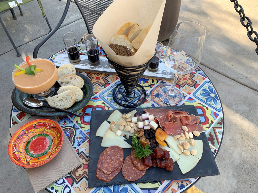 Emanar Cellars in Battle Ground specializes in tapas. Pictured here are gazpacho, a meat-and-cheese plate and a wine flight.