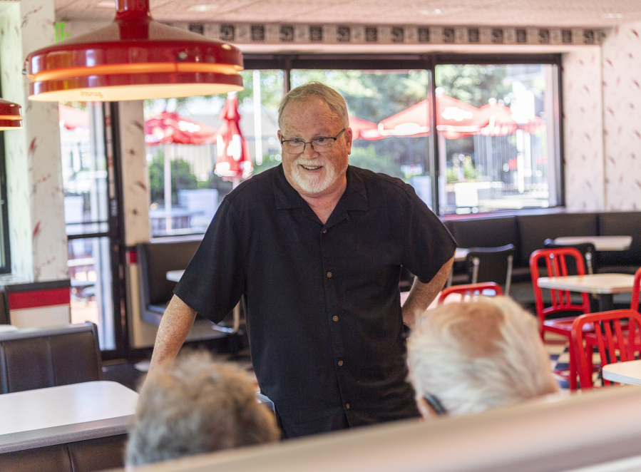 Burgerville CEO Ed Casey talks to customers at Burgerville on East Fourth Plain Boulevard in Vancouver.  "It's all about growth," Casey says of the company's future, noting expected new locations around the metro area.