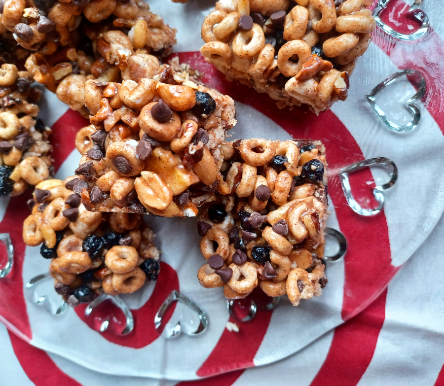 The secret is in the sticky sauce of these no-bake cereal bars: vanilla, almond extract and cinnamon are mixed in to the butter-and-marshmallow coating.