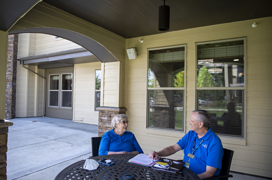 Gwen Swenson, a resident at Bonaventure of Vancouver, left, chats with Bob Kyte, a volunteer for the Southwest Washington Regional Long Term Care Ombudsman Program. Since 2019, Kyte has assisted numerous residents in his two assigned assisted living homes, helping to mediate issues and settle complaints while improving the overall quality of care and life for the residents he serves. He typically averages 25 to 30 hours of donated time per month and has been a mentor and role model for new volunteers.