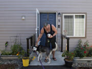 Fruit Valley Terrace resident Ty Wilson enjoys a playful moment with his dog, Apollo. Community Roots Collaborative, the nonprofit that created Fruit Valley Terrace, a tiny home village for people exiting homelessness, has partnered with Amerigroup Washington. Together, the two organizations plan to innovate solutions and collaborate on efforts that help people experiencing homelessness in Southwest Washington overcome barriers to resources.