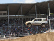 Zach Wallace of Battle Ground flies his Honda through the air as the crowd erupts in support of the driver.