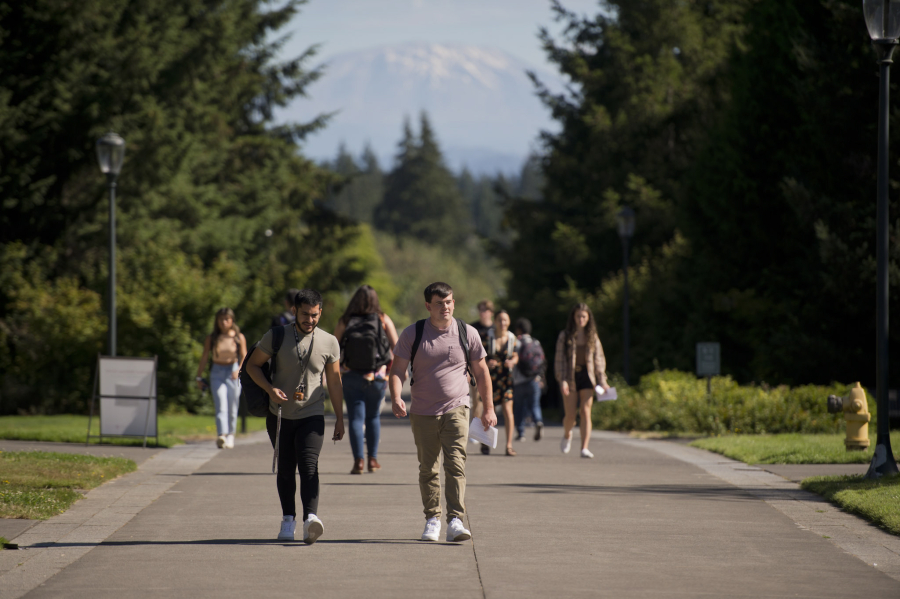 Students make their way to classes with Mount St. Helens in the background at Washington State University Vancouver on Monday.