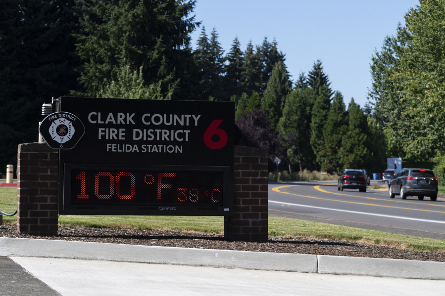 A sign displays a temperature of 100 degrees in August 2022, at the Clark County Fire District 6 Station in Felida.