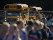 Students arrive for their first day of classes at Union Ridge Elementary School in Ridgefield on Wednesday morning.