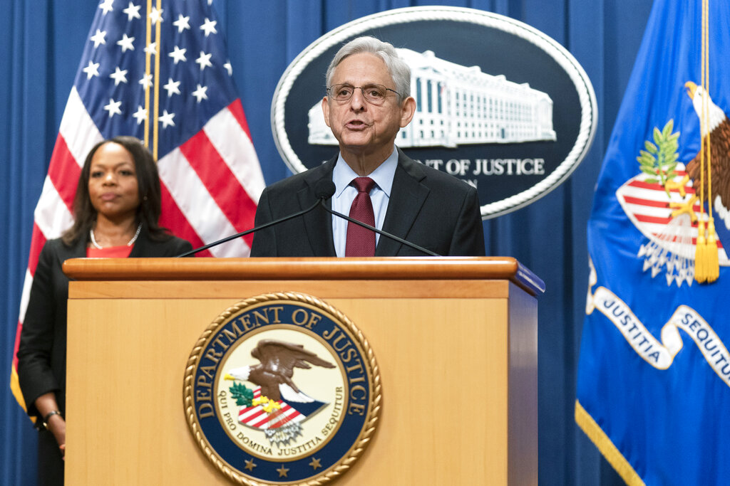 Attorney General Merrick Garland with Assistant Attorney General Kristen Clarke for the Civil Rights Division, speaks during a news conference at the Department of Justice in Washington, Thursday, Aug. 4, 2022. The U.S. Justice Department announced civil rights charges Thursday against four Louisville police officers over the drug raid that led to the death of Breonna Taylor, a Black woman whose fatal shooting contributed to the racial justice protests that rocked the U.S. in the spring and summer of 2020.
