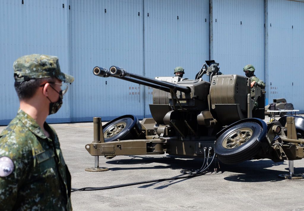 Taiwanese soldiers operate a Oerlikon 35mm twin cannon anti-aircraft gun at a base in Taiwan's southeastern Hualien county on Thursday, Aug. 18, 2022.