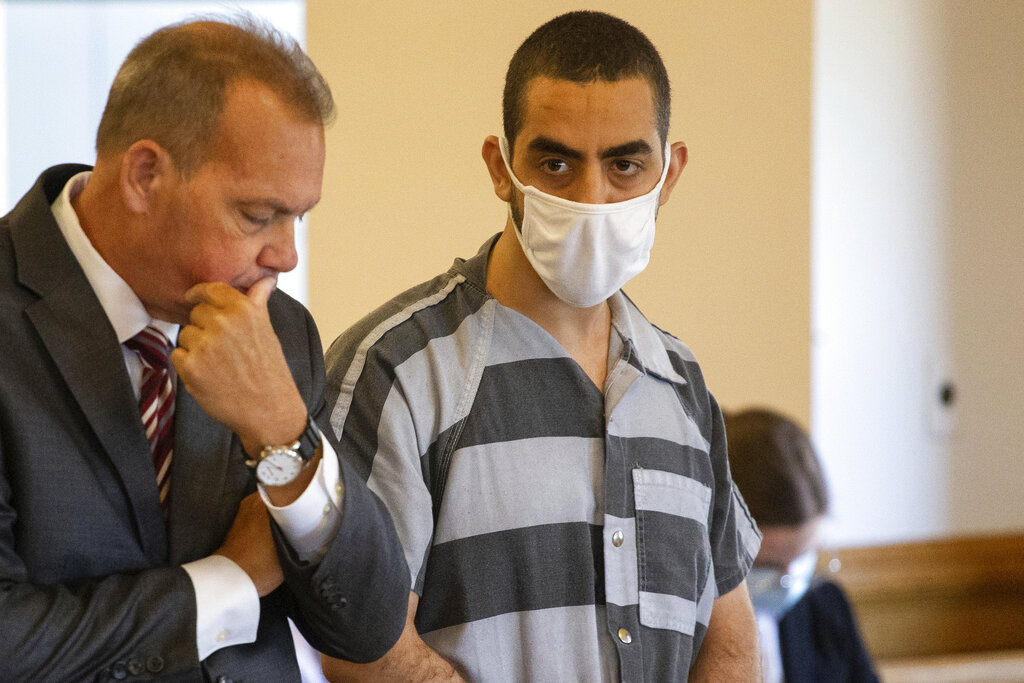 Defense attorney Nathaniel Barone, left, and Hadi Matar, 24, right, listen during an arraignment in the Chautauqua County Courthouse in Mayville, NY., Thursday, Aug. 18, 2022.  Matar was arrested Aug. 12 after he rushed the stage at the Chautauqua Institution and stabbed Salman Rushdie in front of a horrified crowd.