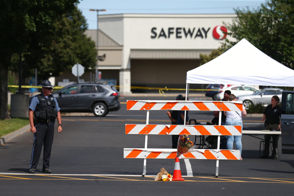 The Forum Shopping Center in Bend, Ore. remained closed Monday, Aug. 29, 2022 as police investigated a shooting at the Safeway there that left two people and the suspected gunman dead Sunday night.