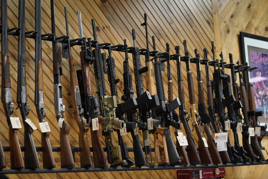 Various guns are displayed at a store on July 18, 2022, in Auburn, Maine. Most U.S. adults think gun violence is increasing nationwide and want to see gun laws made stricter. That's according to a new poll that finds broad public support for a variety of gun restrictions. The poll comes from the University of Chicago Harris School of Public Policy and The Associated Press-NORC Center for Public Affairs Research. (AP Photo/Robert F.