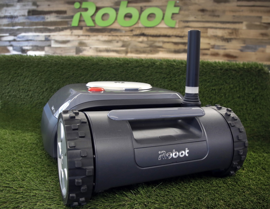 FILE - This Wednesday, Jan. 16, 2019 file photo shows an iRobot Terra lawn mower in Bedford, Mass.  Amazon on Friday, Aug. 5, 2022,  announced it has entered into an agreement to acquire the iRobot for approximately $1.66 billion. The company sells its robots worldwide and is most famous for the circular-shaped Roomba vacuum.