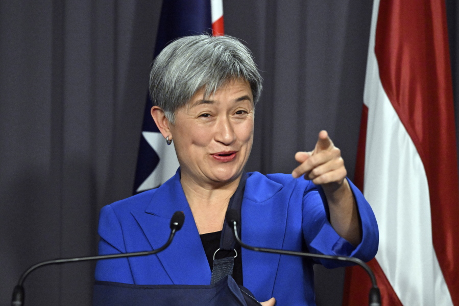 Australia's Foreign Minister Penny Wong gestures during a press conference at Parliament House in Canberra, Monday, Aug. 8, 2022. Wong has called for a cooling of tensions after Beijing accused her of "finger-pointing" in her criticisms of China's military response to U.S. House Speaker Nancy Pelosi's visit to Taiwan.