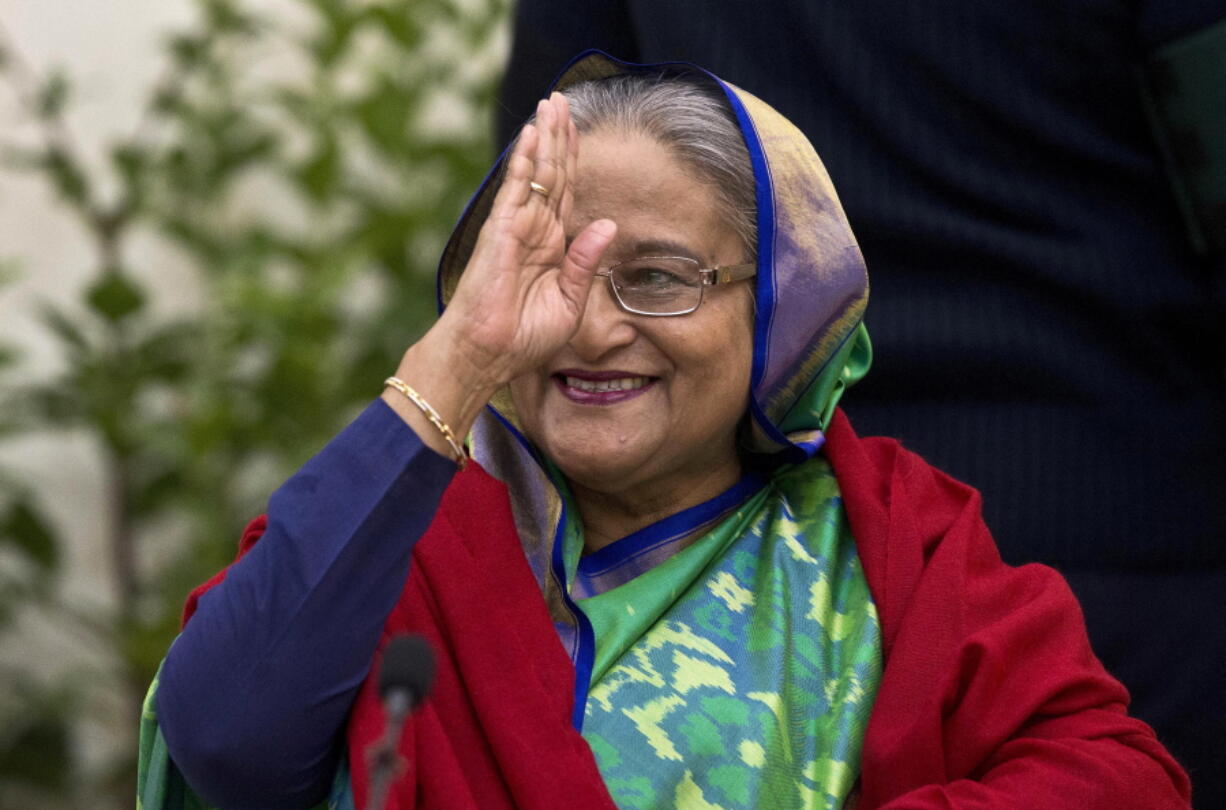 FILE - Bangladeshi Prime Minister Sheikh Hasina greets the gathering during an interaction with journalists after official election results gave her a third straight term, in Dhaka, Bangladesh, Dec. 31, 2018. Hasina on Wednesday, Aug. 17, 2022, told a visiting U.N. official that hundreds of thousands of Rohingya refugees must go back to their ancestral home in Myanmar from crowded camps in neighboring Bangladesh.