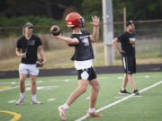 Battle Ground quarterback Kameron Spencer makes a throw on the first day of football practice on Wednesday, Aug. 17, 2022.