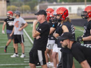 Battle Ground head coach Mike Woodward watches his team on the first day of football practice on Wednesday, Aug. 17, 2022.