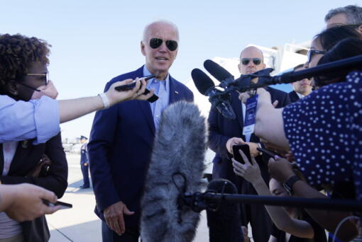 President Joe Biden speaks to the media before boarding Air Force One for a trip to Kentucky to view flood damage, Monday, Aug. 8, 2022, in Dover Air Force Base, Del.
