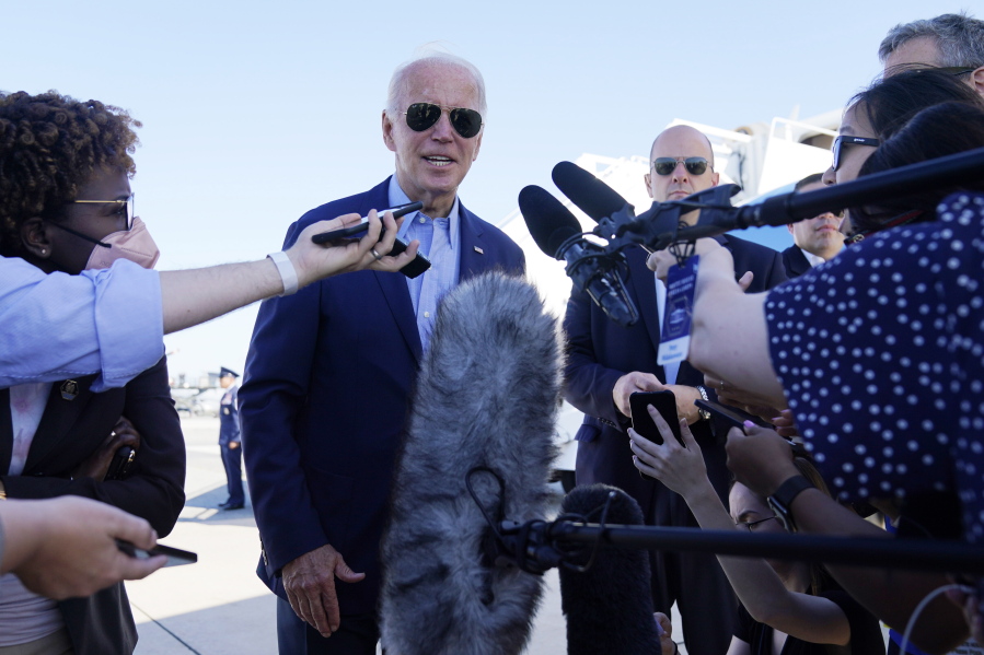 President Joe Biden speaks to the media before boarding Air Force One for a trip to Kentucky to view flood damage, Monday, Aug. 8, 2022, in Dover Air Force Base, Del.