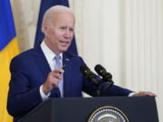 FILE - President Joe Biden speaks in the East Room of the White House in Washington, Tuesday, Aug. 9, 2022. Climate activists are clamoring for President Joe Biden to declare a national climate emergency, calls the White House has so far not headed.
