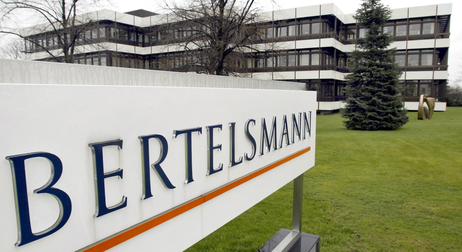 FILE - An outside view of the German media giant Bertelsmann in Guetersloh, Germany, is shown March 13, 2003. The government and publishing titan Penguin Random House, owned by Bertelsmann, are set to exchange opening salvos in a federal antitrust trial Monday, Aug. 1, 2022, as the U.S. seeks to block the biggest U.S. book publisher from absorbing rival Simon & Schuster.