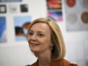 Conservative Party leadership candidate Liz Truss smiles during a visit to the Onside Future Youth Zone in London, Monday, Aug. 8, 2022. As Britain swelters through a roasting summer, and braces for a cold financial reckoning in the fall, calls for the Conservative government to act are getting louder.But the Conservatives are busy choosing a new leader, through a prolonged party election whose priorities often seem remote from the country's growing turmoil.
