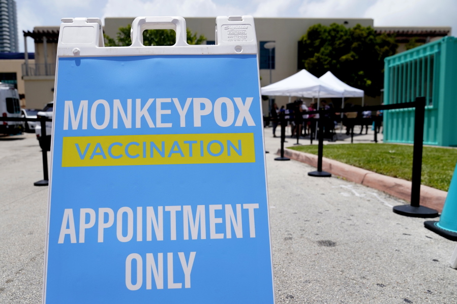 FILE -  A sign for monkeypox vaccinations is shown at a vaccination site, Wednesday, Aug. 10, 2022, in Miami Beach, Fla. British health officials say the monkeypox outbreak across the country "shows signs of slowing" but that it's still too soon to know if the decline will be maintained. In a statement on Monday, Aug.